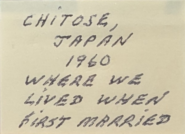 A cut-out piece of yellow post-it paper, labeled in pen with my Ojiji's shaky all-caps handwriting. It reads Chitose, Japan. 1960. Where we lived when first married.